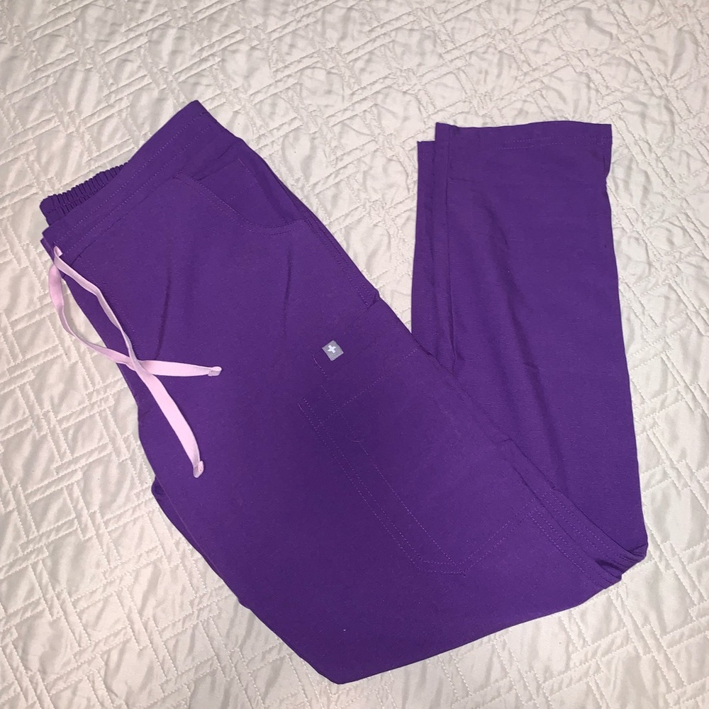 Figs purple scrub pants.